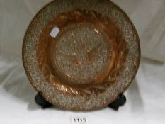 A copper artist craft plate