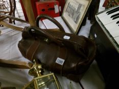 A leather Gladstone bag