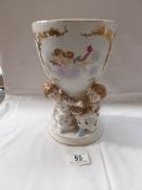 A porcelain pot (possibly oil lamp base) supported by 4 children,