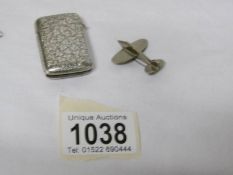 A Victorian silver match holder and an aeroplane brooch