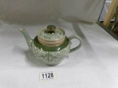 A Macintyre teapot circa 1902, Gesso Faience, stamped Macintyre, Burslem, England,
