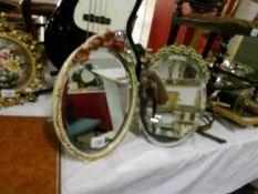 2 floral decorated mirrors