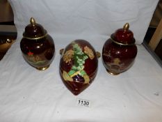 A pair of Carlton ware lustre lidded urns and a Crown Devon lustre ware wall pocket