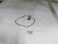A silver pocket watch chain with crab claw clasp, T bar and rare Louis XVI silver coin, 1778, 26.