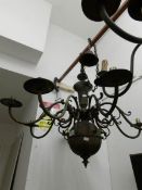 A 6 lamp plated brass ceiling light with surmounted figure heads