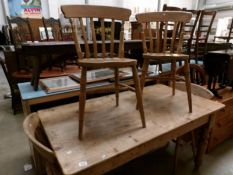 A pine kitchen table and 4 chairs