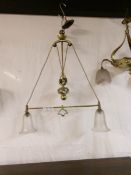 An Edwardian rise and fall brass ceiling light