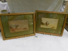 A pair of framed and glazed watercolour Arabian scenes
