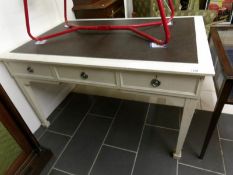 A white painted partners desk with leather inset