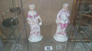 A pair of Victorian bisque figurines marked with a blue W