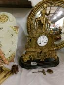 A French spelter clock surmounted figure