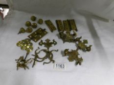 A mixed lot of brass cabinet fittings