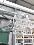 A 6 light metal and glass chandelier