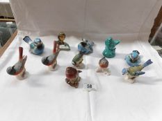 A collection of bird figures including Beswick and Goebel