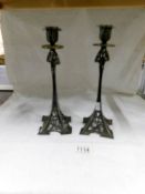 A pair of Mackintosh style candlesticks