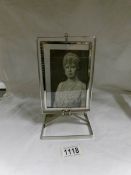 A signed photograph of Queen Mary in frame
