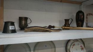 A mixed lot including brass pump, crumb tray, lidded pot, metal jug, tankard,