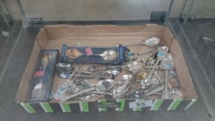 A quantity of souvenir spoons