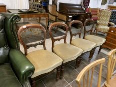 A set of 4 Victorian balloon back dining chairs