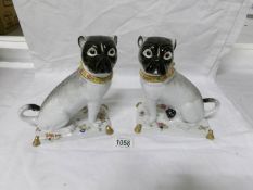 A pair of Chelsea House pug dogs