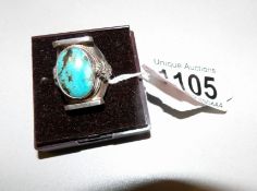 A vintage silver and turquoise ring