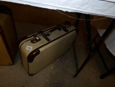 A 1950's German suitcase with key etc