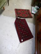 2 red patterned rugs