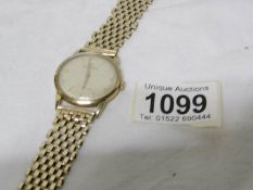 A Gentleman's Movado all gold watch in working order,