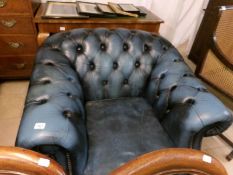 A blue leather 'Chesterfield' chair