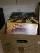 A box of 60 LP records including Beatles, Bowie, Genesis, Deep Purple,