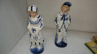 A pair of continental blue and white figures