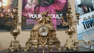 A 3 piece brass clock garniture