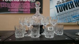 A cut glass decanter and glasses