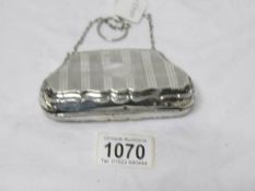A silver purse, hall marked Birmingham, date mark indistinct,