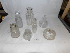 6 glass bottles and a trinket pot