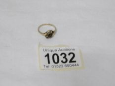 A 9ct gold garnet twist ring