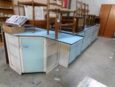 A range of 1950's kitchen cabinets comprising corner unit,