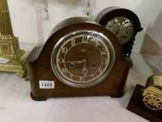 A Smith's Enfield mantel clock in working order and with key and pendulum