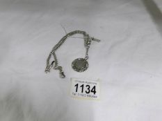 A silver pocket watch chain with 2 crab claw clasps, T bar and silver 1904 swimming medal, 28.