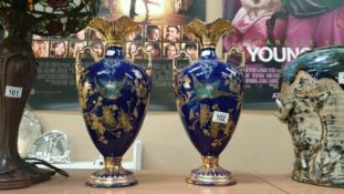 A pair of Victorain gilded vases with bird decoration