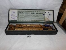 A boxed "Reliable" sign maker set