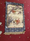 A silk rug depicting animals