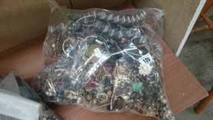 A very large bag of costume jewellery mainly for spares and repairs