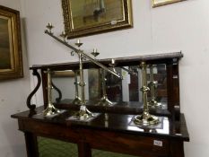 A pair of Victorian brass Church candlesticks and a candelabra