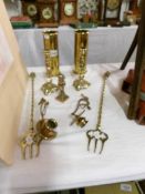 A mixed lot of brassware including shell cases, Lincoln Imp, candlesticks, toasting forks,