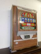 A vintage autofruit penny fruit machine