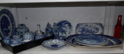 A mixed lot of blue and white including meat platter, plates, pair early lidded vases,