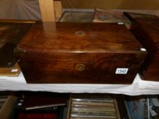 A walnut veneered brass bound writing box