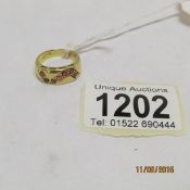 An 18ct gold ring set rubies