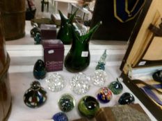 A collection of glass paperweights including Caithness